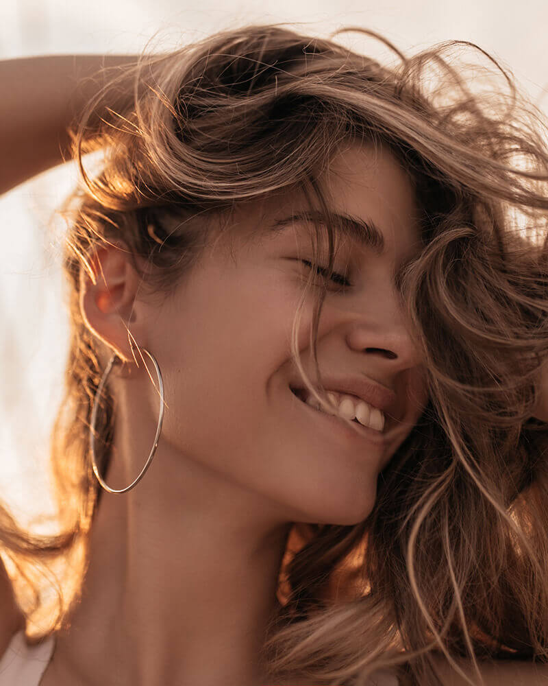 Woman smiling in the sun