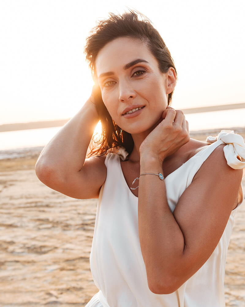 Beautiful mature woman at the beach