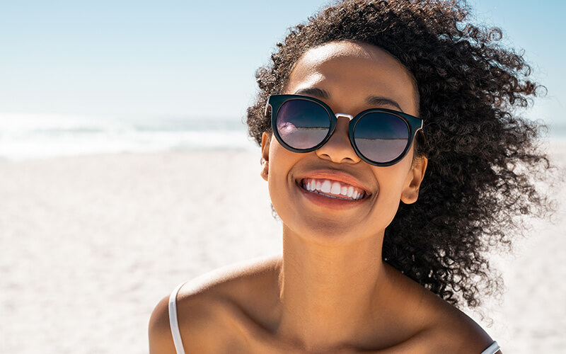 Woman with glasses at the beach