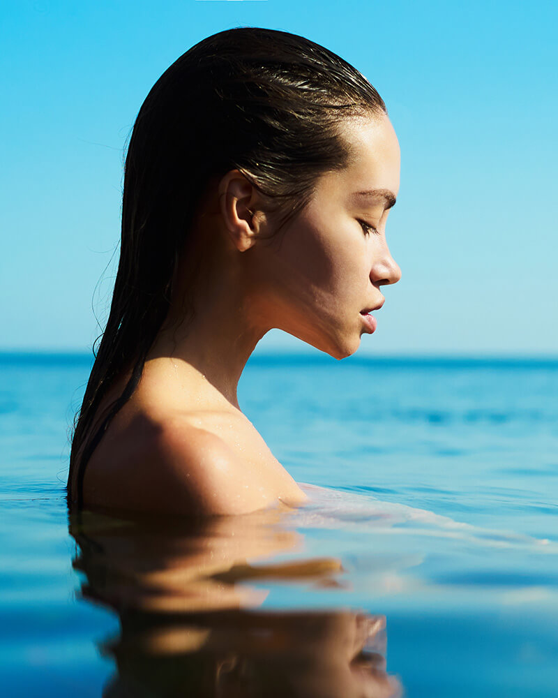 Young woman treading water