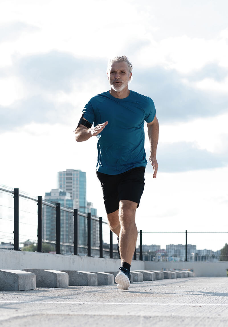 Fit man jogging outside