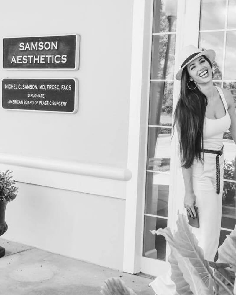 Woman standing by the practice sign